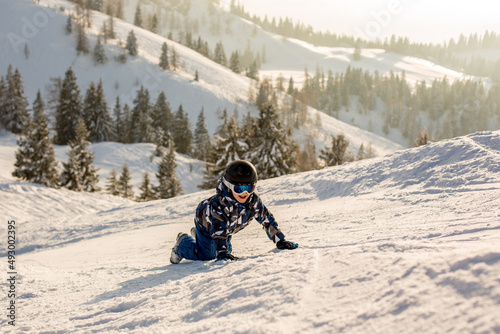 Cute preschool child, boy, skiing happily in Austrian Apls © Tomsickova