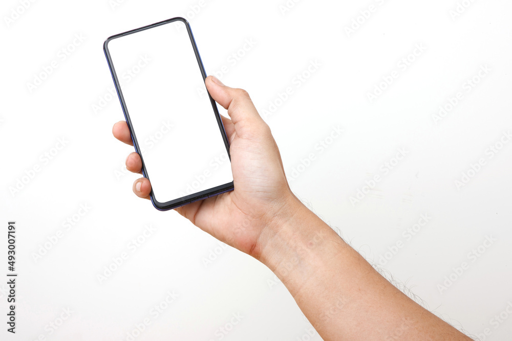 Front View of Man Holding Smart phone . Cell phone in Man hand on a white background With white display for COPY SPACE. Front View of Man Holding Smart phone . Cell phone in Man hand on a white background With white display for COPY SPACE.