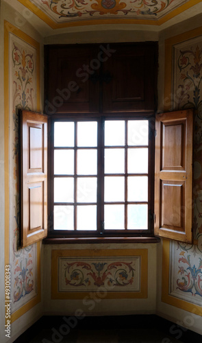 interior view of a ancient old window made of wood and decorated wall