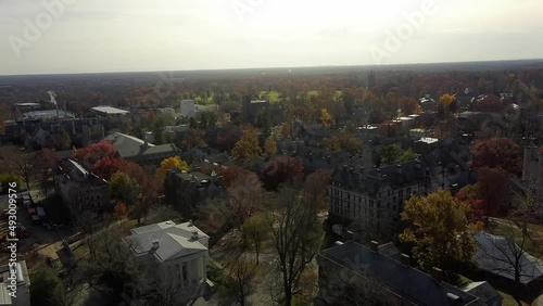 Aerial pass over Princeton New Jersey as the sun is low in the sky during an Autumn day. photo