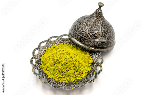 Ground pistachios or Powdered Pistachio isolated on white background. Local name toz fistik. close up