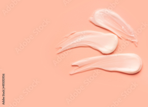 White cream smudge swatch textured peach pink colored background