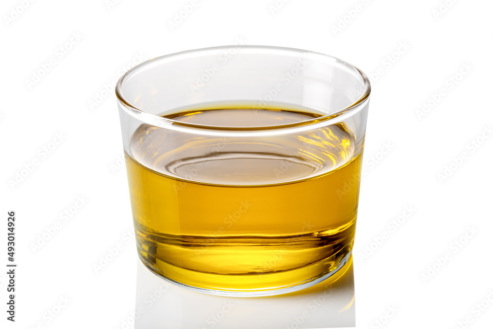 Extra virgin olive oil in glass cup on white background, clipping path Extra virgin olive oil in glass cup on white background, clipping path