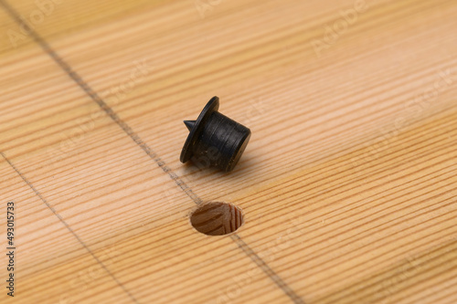 Marking of the hole in the furniture panel. Transfer the center of the hole for an exact match using a spike.