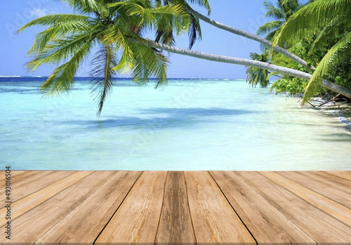 Fototapeta Naklejka Na Ścianę i Meble -  Empty wooden table with palm in the beach on background