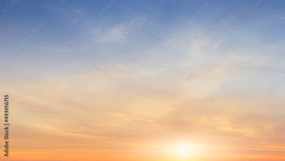 Sunset sky background with orange sunrise clouds in the morning, nature landscape nice peaceful sunshine in summer season