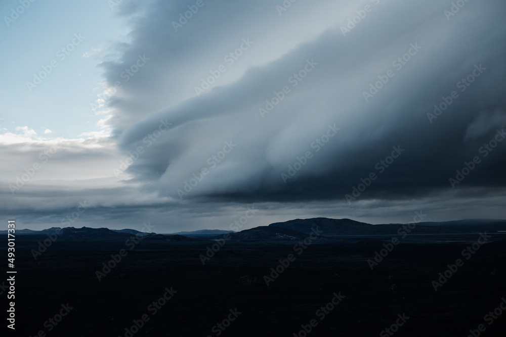 Massive storm clouds over the mountains in Iceland