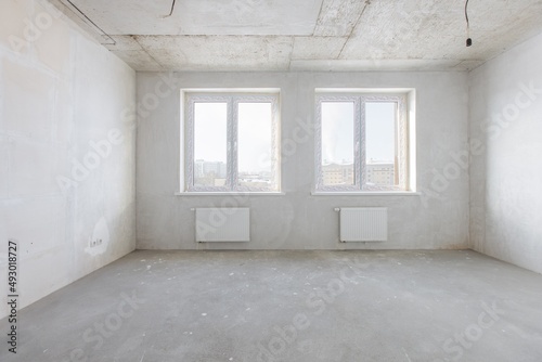 interior of the apartment without decoration in gray colors © gluschenkoart