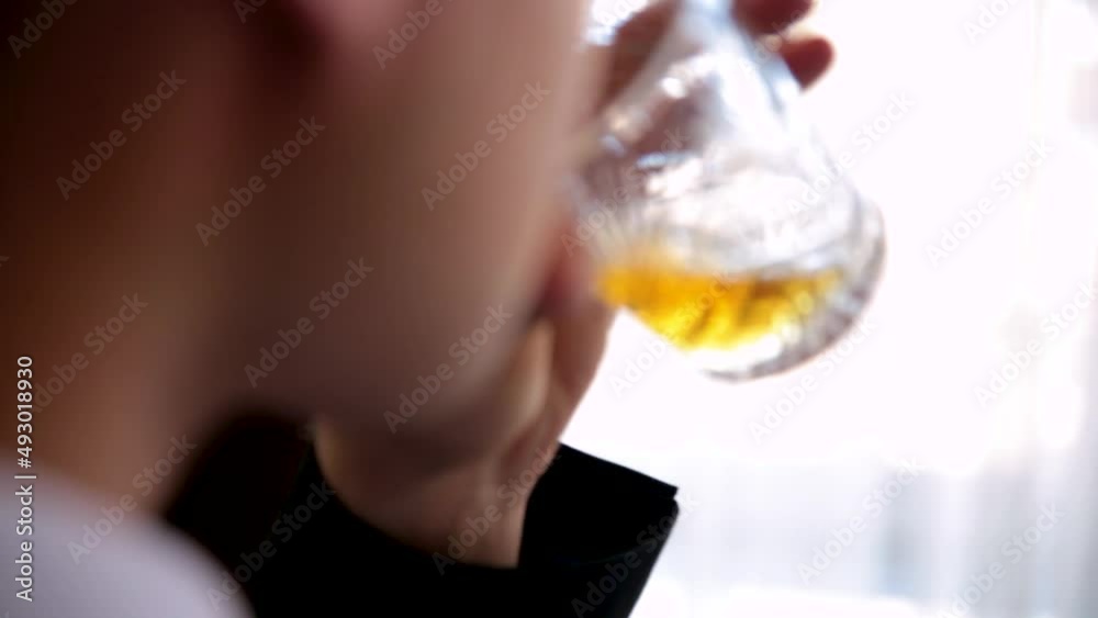 Young man with glass of whiskey at home. Drink. Rom. Brandy. Young man with glass of whiskey at home. Drink. Rom. Brandy.