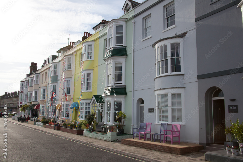 Colourful houses on the beach front in Weymouth, Dorset in the UK