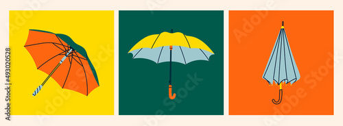 Umbrellas in various positions. Open and folded umbrellas. Set of three Hand drawn colored Vector illustrations. Cartoon style. Design templates. All elements are isolated photo
