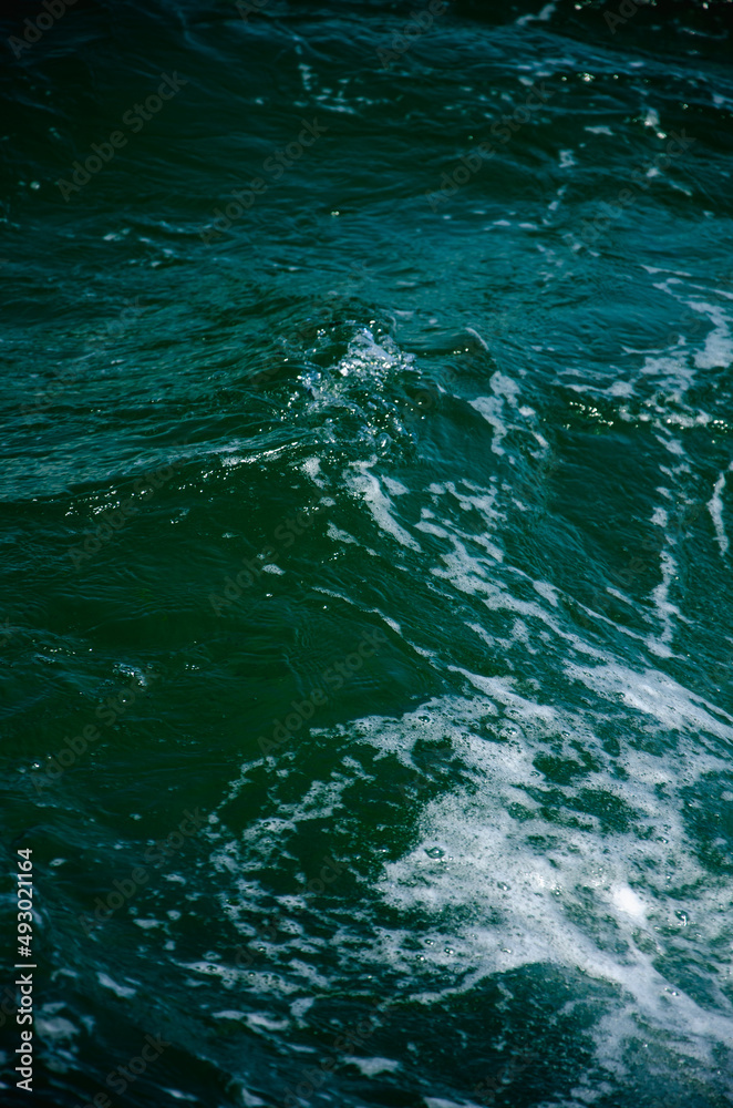 Sea abstract background dark blue surface of water