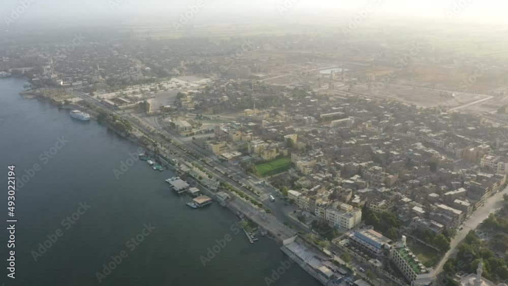 Aerial Drone Panning shot of Karnak Temple and city of Luxor in Egypt Aerial Drone Panning shot of Karnak Temple and city of Luxor in Egypt