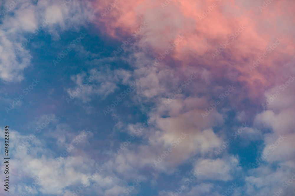 Colorful clouds over blue skies