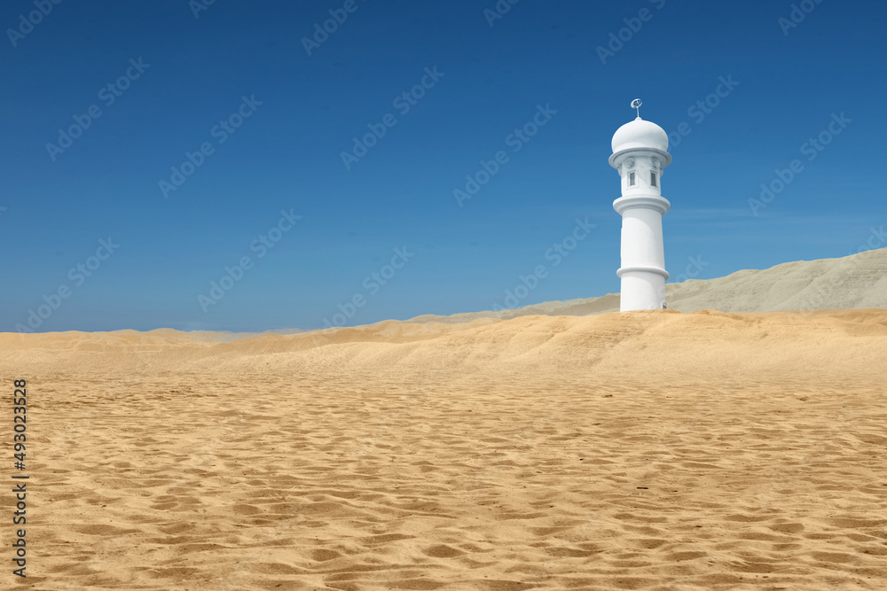 Mosque minaret on the desert