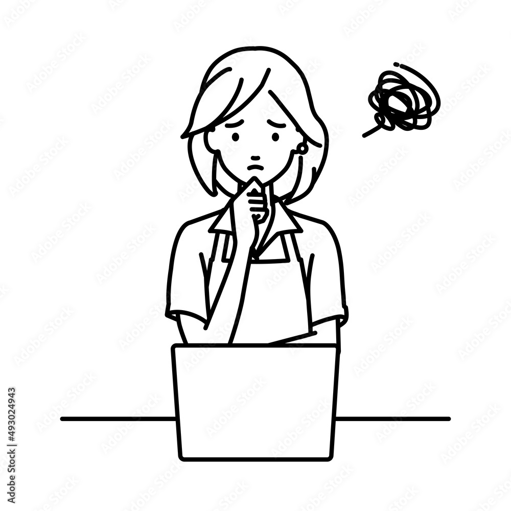 デスクで座ってPCを開いて困っている店員の女性 デスクで座ってPCを開いて困っている店員の女性