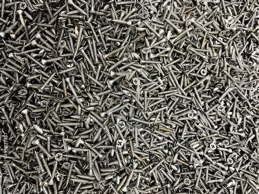 Many black of self-tapping screws. Construction Materials. Texture. Background. Many black of self-tapping screws. Construction Materials. Texture. Background.