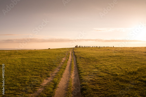 Ale Stones (Ales stenar) Is a megalithic monument of 59 large boulders and is 67 meters long. This landmark is located in Kåseberga, Sweden photo