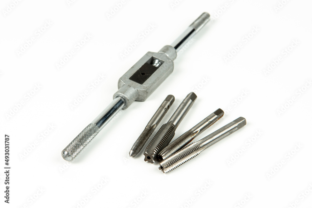 a set of professional tools for threading a hole in a repair