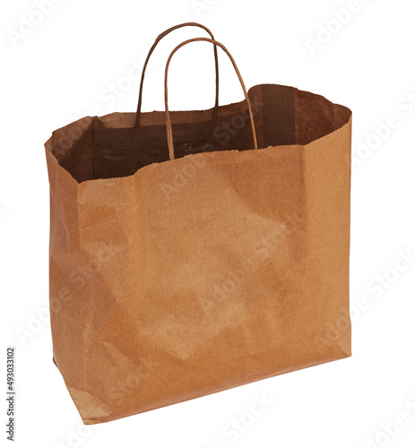 Flying brown beige craft paper bag filled with crumpled isolated