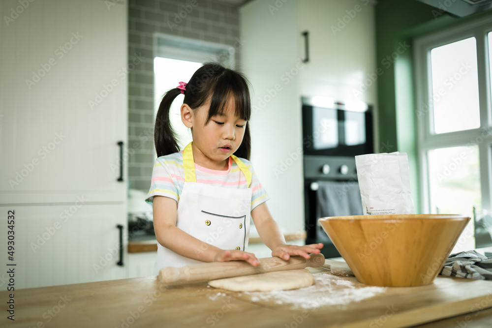 young girl making bread dough at home kitchen for home schooling young girl making bread dough at home kitchen for home schooling