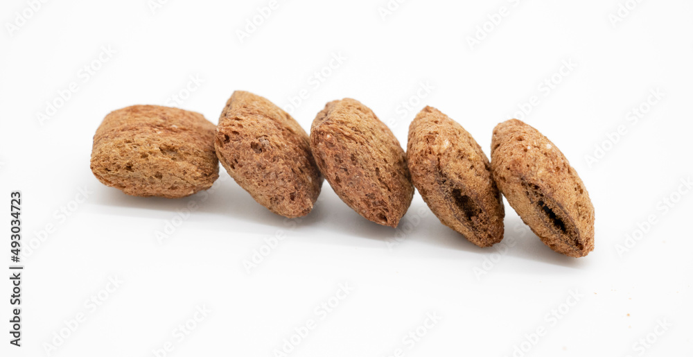 selective focus, chocolate chips isolated on white background selective focus, chocolate chips isolated on white background