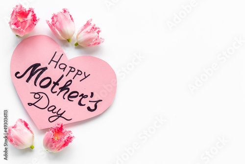 Greeting card Happy Mothers day with pink tulips, top view