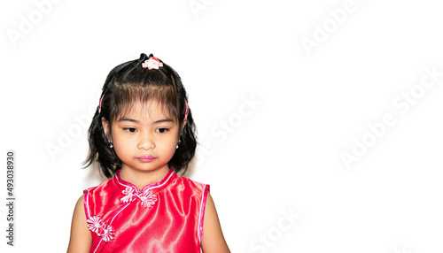 Little Asian girl uneasy look