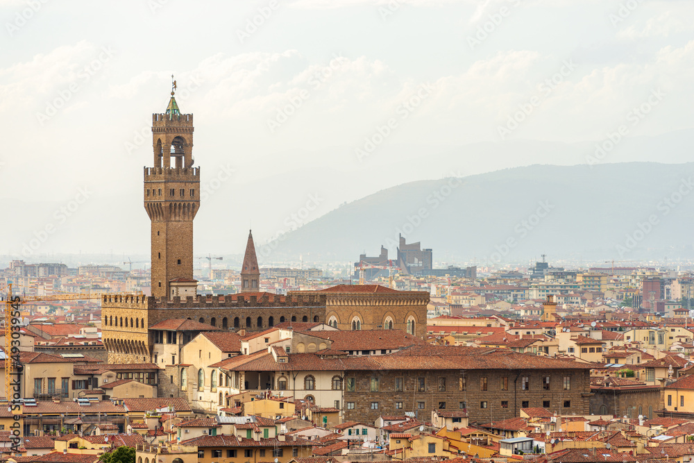 Florence cityscape with the medieval Palazzo Vecchio (Old Palace - 1299), with the clock tower called Torre di Arnolfo, UNESCO world heritage site. Tuscany, Italy, southern Europe.