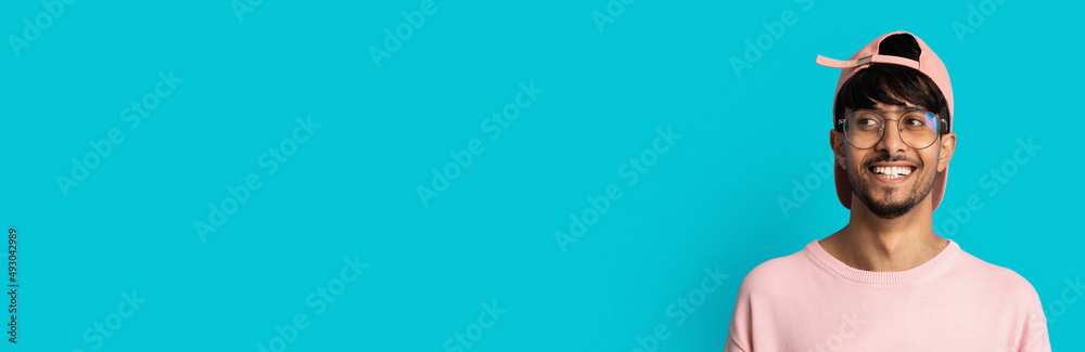 Stylish indian guy looking at copy space, closeup shot Stylish indian guy looking at copy space, closeup shot