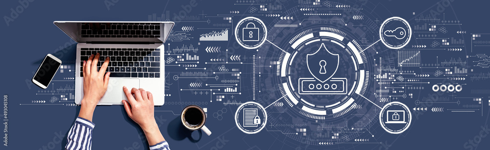 Cyber security theme with person using a laptop computer Cyber security theme with person using a laptop computer