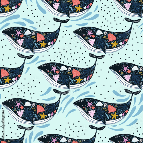 Seamless pattern with cute whales with marine treasures on a body. Childish marine blue texture for fabric, textile,apparel. Vector background