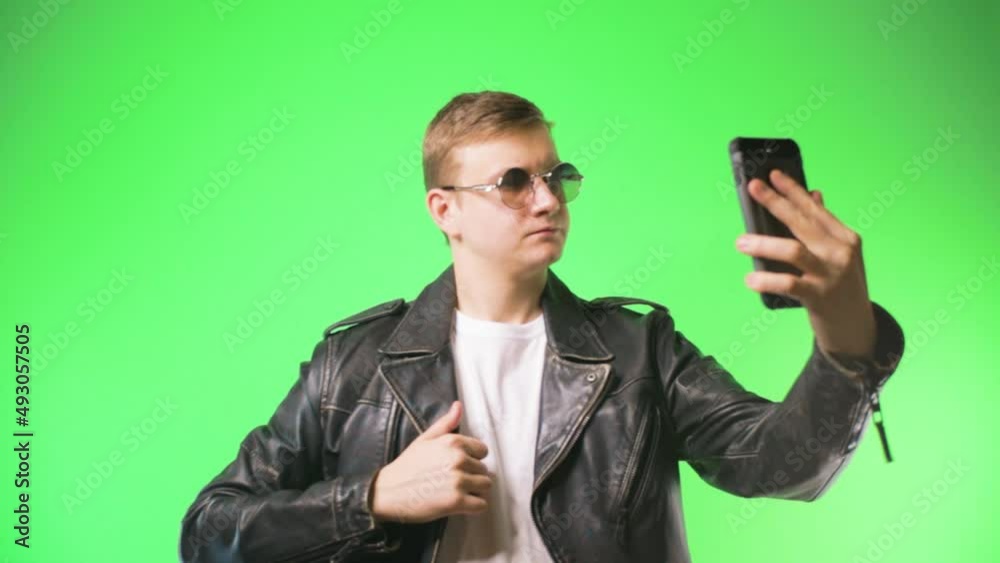 young man takes a selfie chromakey fashion happy young man takes a selfie chromakey fashion happy