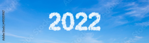 Year 2022 word made of clouds on blue sky background