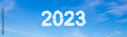 Year 2023 word made of clouds on blue sky background