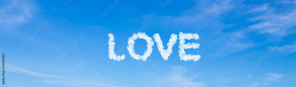 Love word made of clouds on blue sky background Love word made of clouds on blue sky background