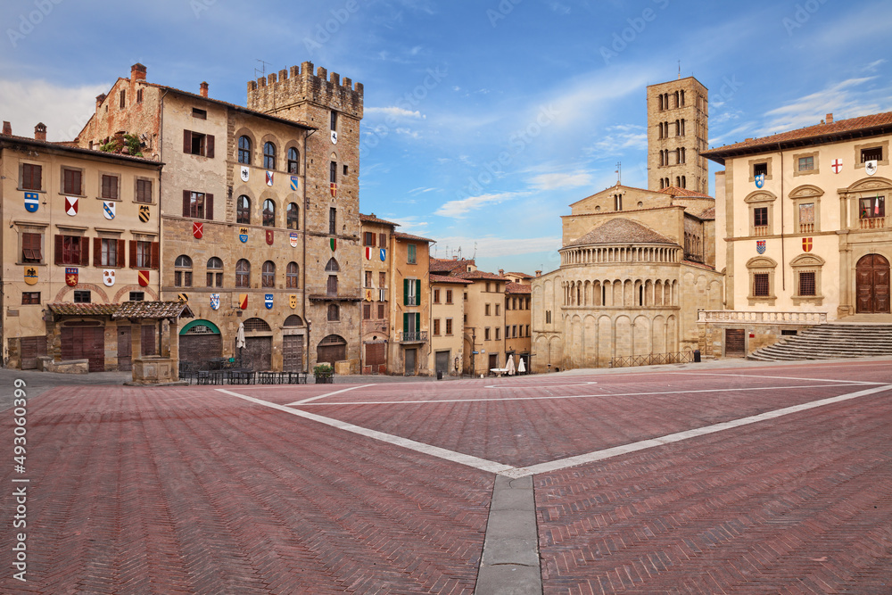 Arezzo, Tuscany, Italy: the main square Piazza Grande with the medieval church and buildings, in the old town of the ancient Italian city of art