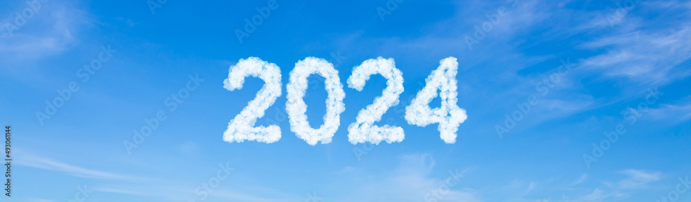 Year 2024 word made of clouds on blue sky background Year 2024 word made of clouds on blue sky background