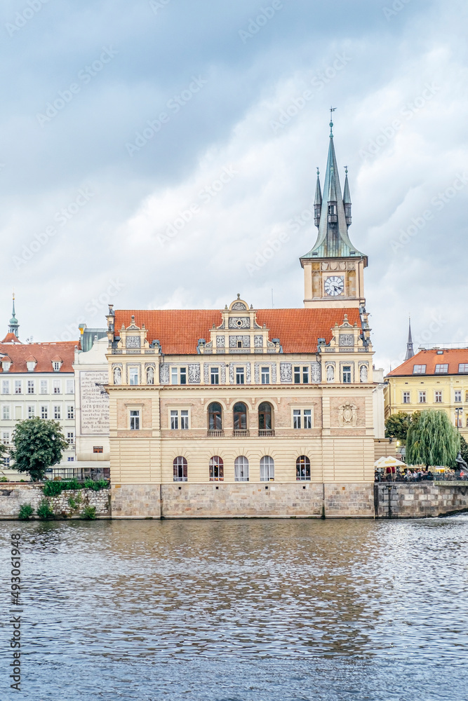 view of a building on the Vltava river next to the city's bridges. Prague, Czech Republic