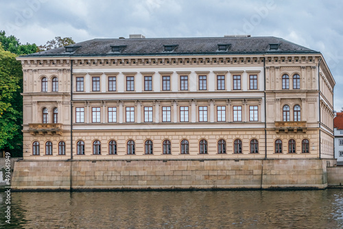 view of a building on the Vltava river next to the city's bridges. Prague, Czech Republic © ikuday