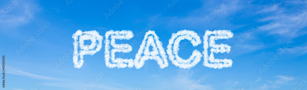 Peace text made of clouds on blue sky background Peace text made of clouds on blue sky background