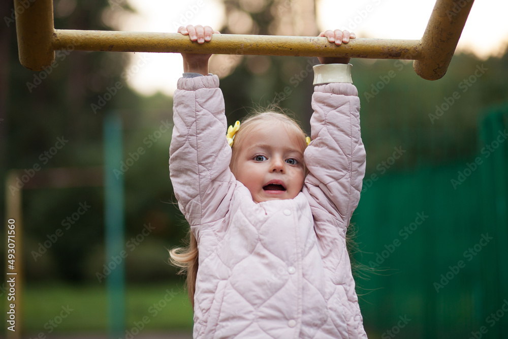 Portrait of little girl playing outdoors. Autumn Portrait of little girl playing outdoors. Autumn