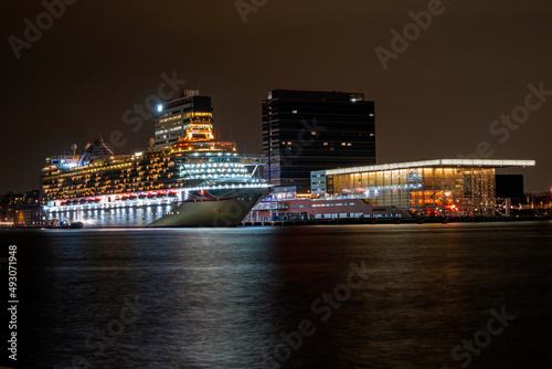 Photography Cruise ship in Amsterdam harbor in the Netherlands by night