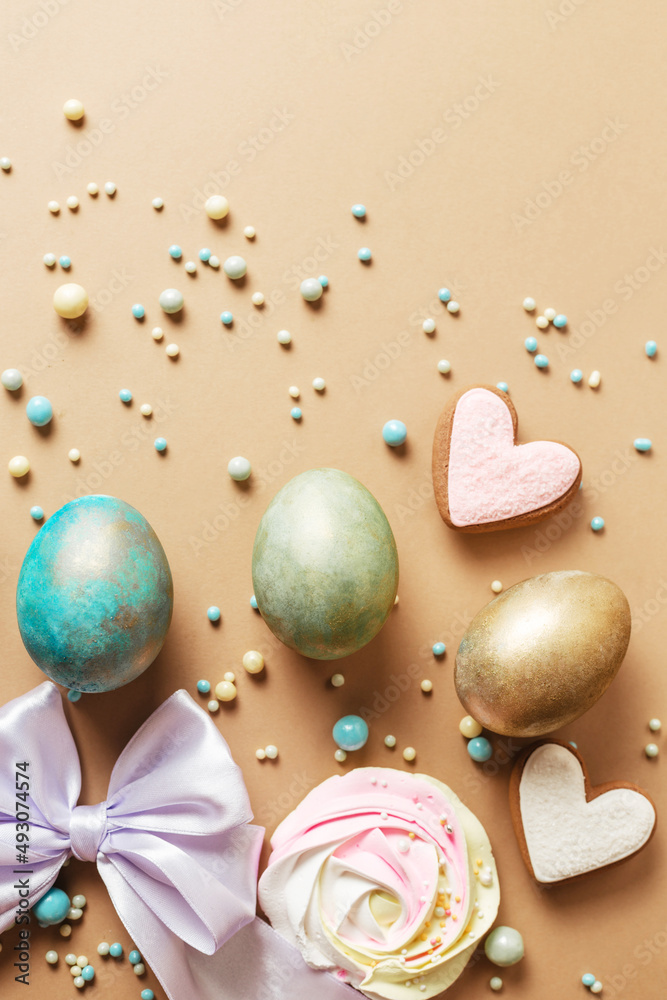 Creative design for Easter with eggs and sweets. Stylish egg hunt concept with candy and decor