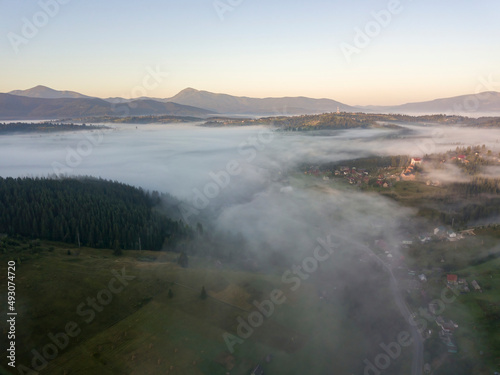 Morning fog in the Ukrainian Carpathians. Aerial drone view.