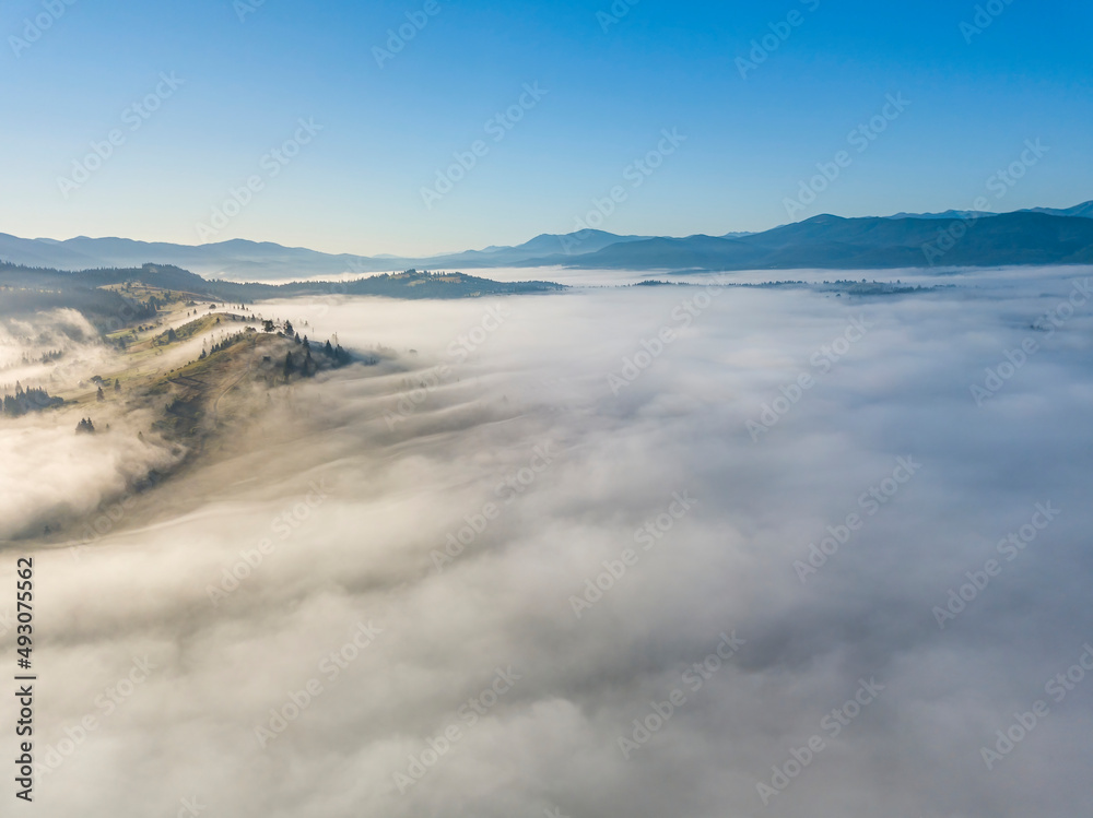 Morning fog in the Ukrainian Carpathians. Aerial drone view.