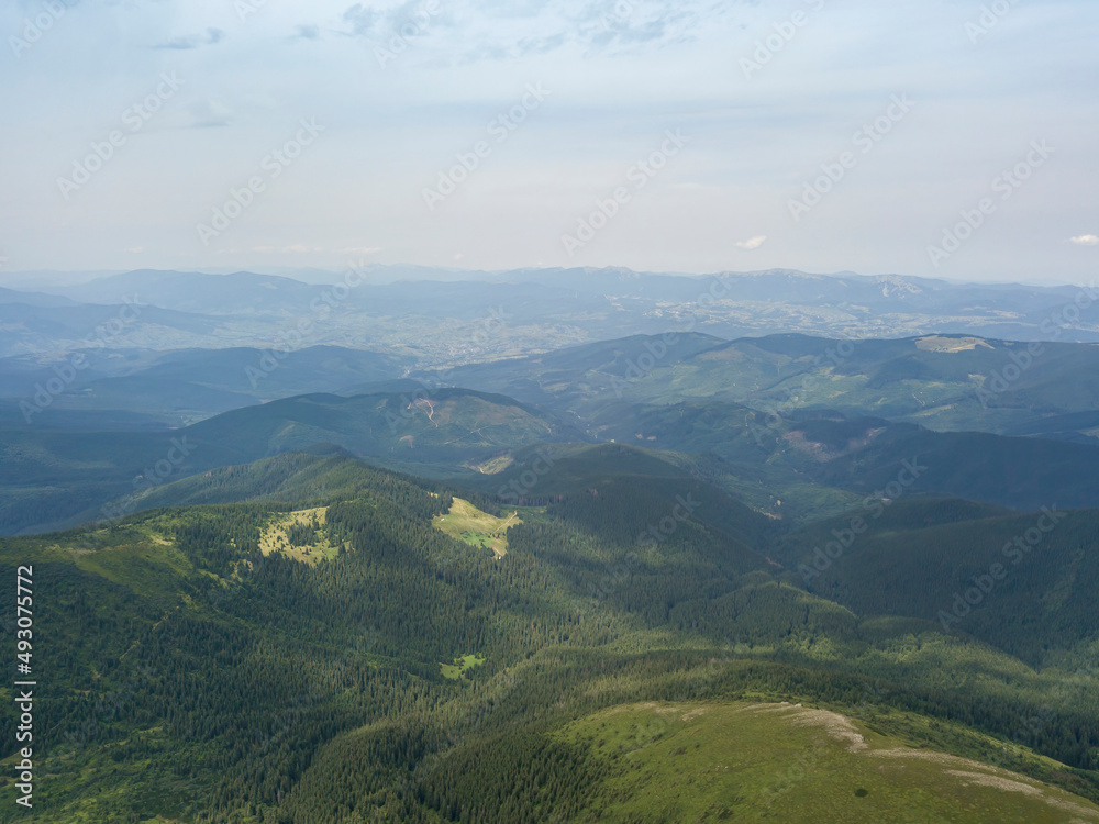 High mountains of the Ukrainian Carpathians in cloudy weather. Aerial drone view.