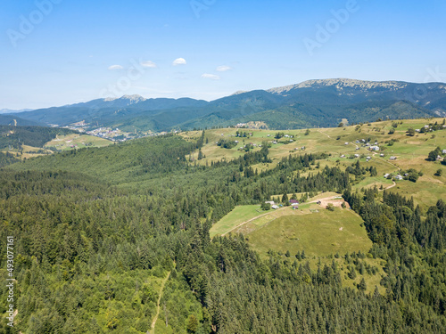 Green mountains of Ukrainian Carpathians in summer. Sunny clear day. Aerial drone view.