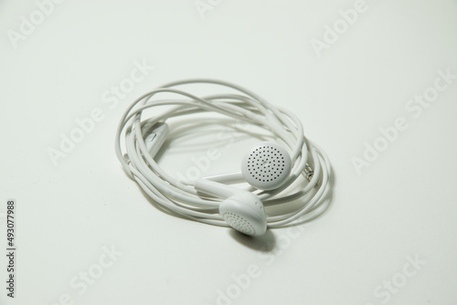 white wired headphones on a white background