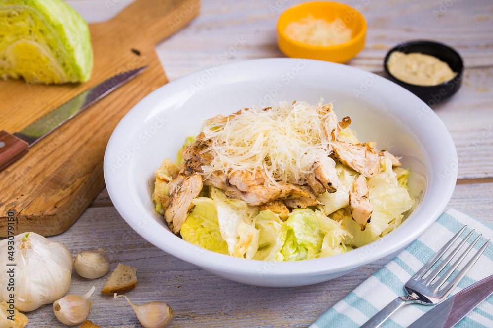 A vegetarian caesar salad made with special ingredients, fresh greens and grilled chicken
